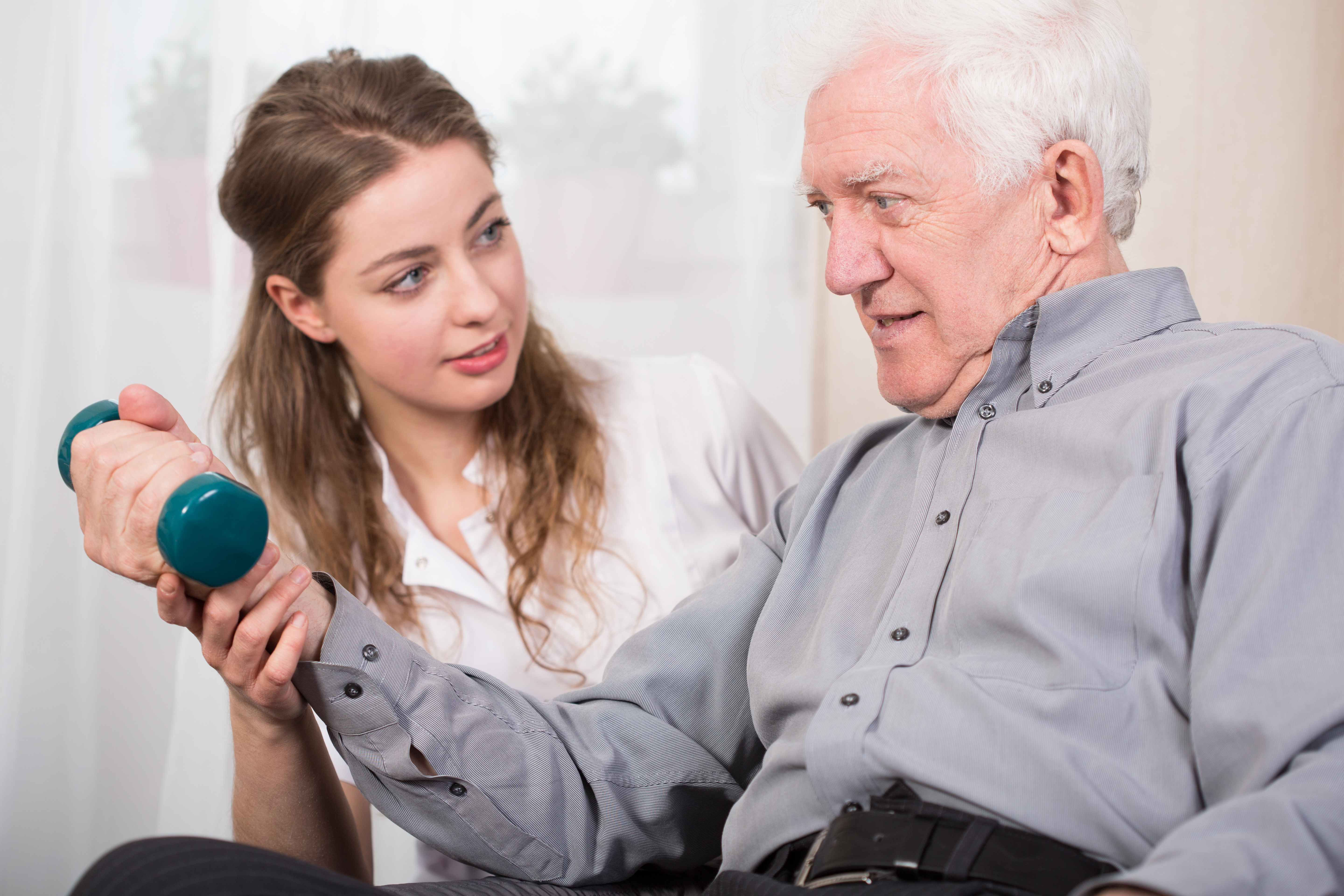 Therapist with Elderly Patient